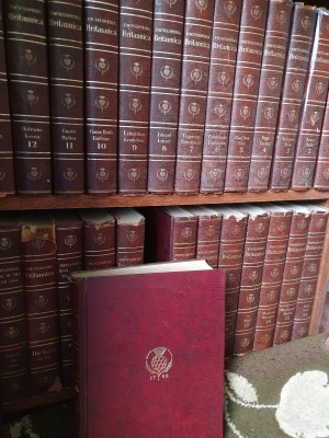 Value of Encyclopedia Britannica - volumes on a bookshelf