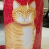 A tall slender round tip with a picture of a ginger cat on the front.