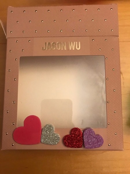 Valentine's Day Candy & Gift Box - laying out stickers to cover wording on bottom front of the box