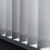 Vertical blinds hanging in a window.