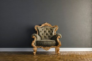 A vintage chair in a plain setting.