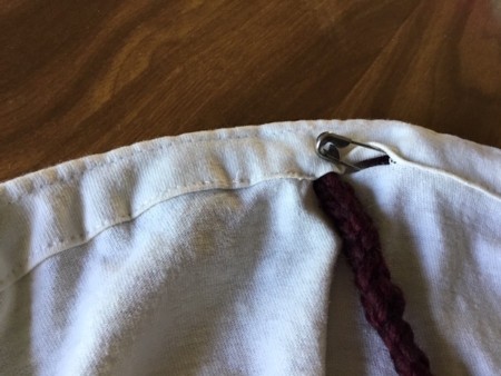 Making a Bag from a T-shirt - pull the cord through using the safety pin as a leader