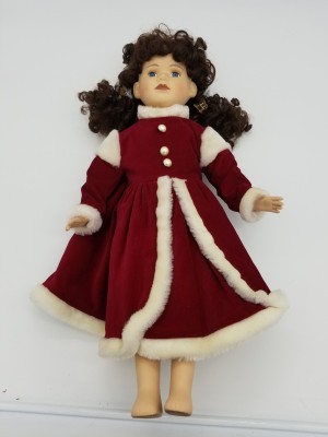 Identifying a Porcelain Doll - doll wearing a long red coat style dress with white fur trim