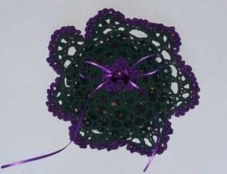A sachet made with doilies and ribbon.