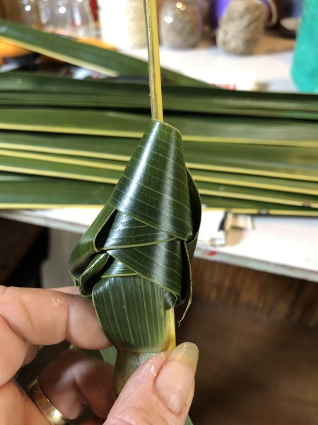 Making Woven Coconut Leaf Shrimp - continue working up the stem until the leaf is very narrow then tie off to make feelers