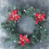 A Christmas wreath with red poinsettias.