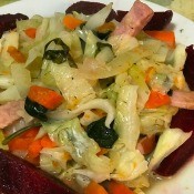 A plate of ham and cabbage stir fry.