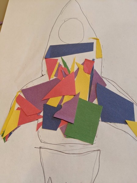 Paper Mosaic Art for Kids - gluing down pieces of paper and cutting to fit along the edges