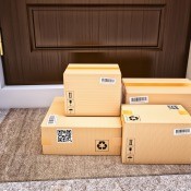 A pile of packages delivered to a home.