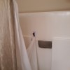 Prevent Mold and Mildew on Shower Curtain Liners - liner clipped to the side wall of the shower