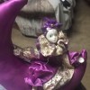 Identifying a Porcelain Doll - doll sitting on a purple stuffed crescent moon