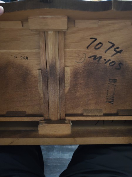 The bottom of a chest of drawers.