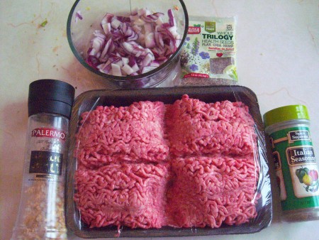 Ground beef, spices and chopped onion.