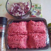 Ground beef, spices and chopped onion.
