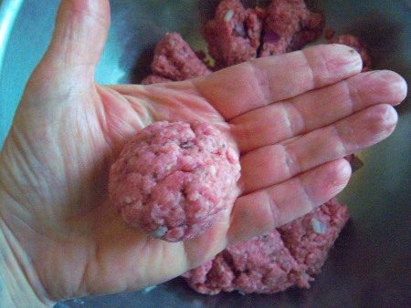 A meatball formed from one of the sections of divided ground beef.