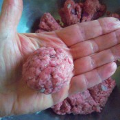 A meatball formed from one of the sections of divided ground beef.