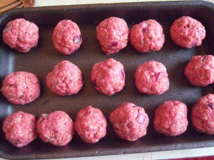 A tray of homemade meatballs, before cooking.