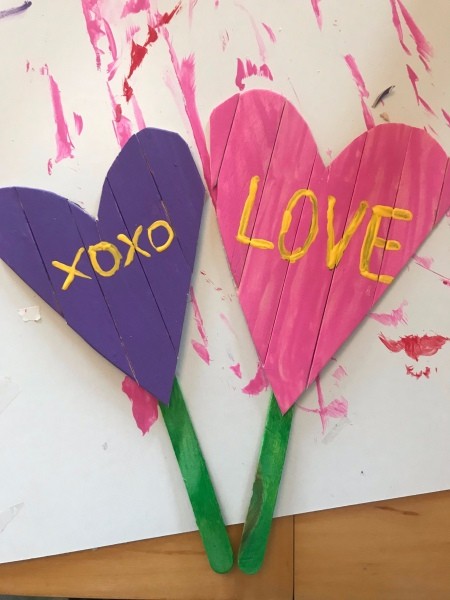 Heart Garden Stakes - a purple and a pink heart shape with green stems