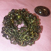 Identifying a Brooch - ornate brooch with stone removed from center