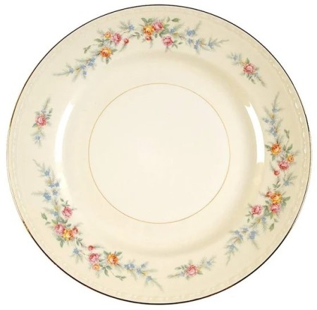 A Homer Laughlin plate with a flowered pattern.