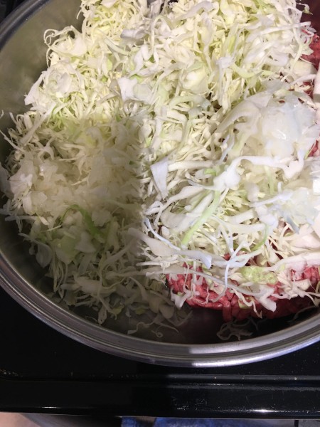 burger & cabbage in pan