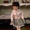 Identifying a Porcelain Doll - doll in pink jacket and gray skirt