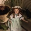 Value of Porcelain Dolls - doll wearing a green dress