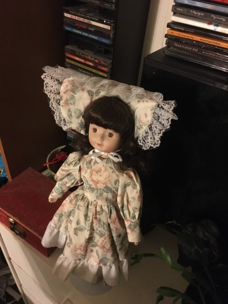 Value of Porcelain Dolls - doll in floral print dress