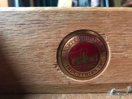 A makers mark plate for a piece of Bassett furniture.