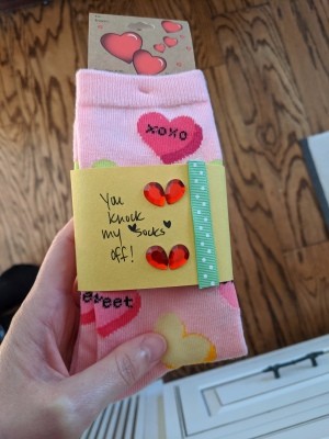 Sock Sleeve for a Gift - sleeve around a pair of pink socks with hearts