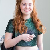 A teen girl wearing a crop top.