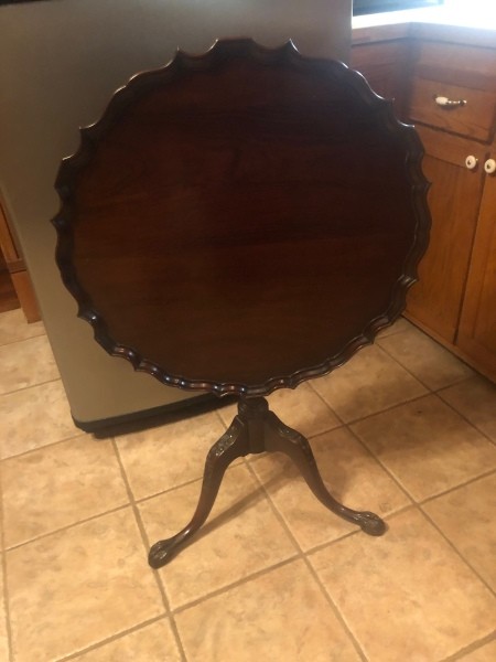 A pie table with the top folded away.