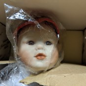 Value of a Yolanda Bello Porcelain Doll - face of the doll in a box