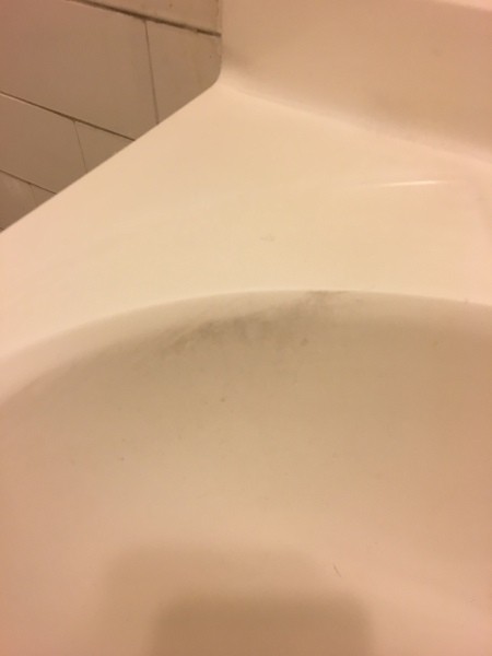 Source of Black Soot Sticking to All Plastic Items in Apartment