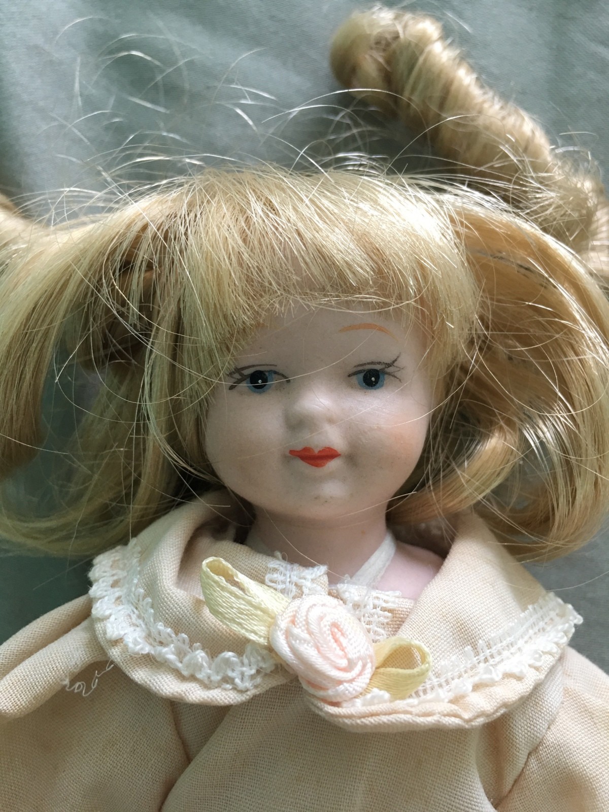 porcelain doll with teeth