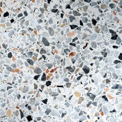 Terrazzo flooring in white with colored flecks.