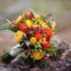 An orange and yellow wedding bouquet, perfect for fall.