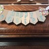 Happy Easter Banner - glue the eggs in place at the ends and add lengths of ribbon for hanging, front view of banner hanging on a wood mantle