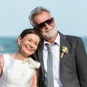 An older couple getting married at the beach.
