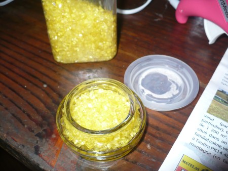 Decorative Fabric Covered Glass Canisters - adding yellow colored rocks