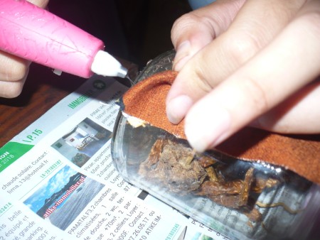 Decorative Fabric Covered Glass Canisters - fold under the bottom edge and glue in place