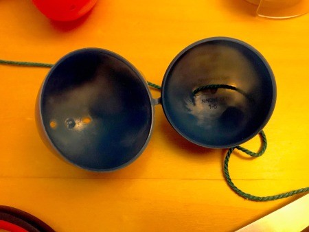 Making a Plastic Egg Garland - open the eggs and thread the twine though