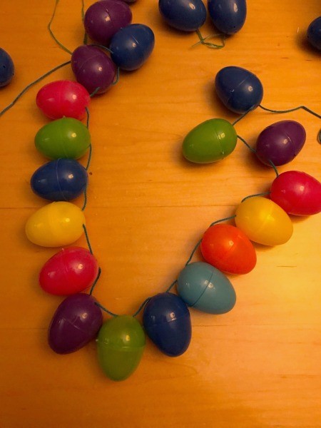 Making a Plastic Egg Garland - continuing to lengthen the garland
