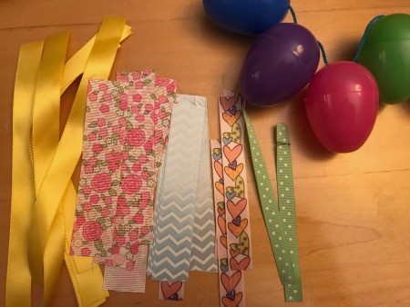 Making a Plastic Egg Garland -cut ribbon into strips