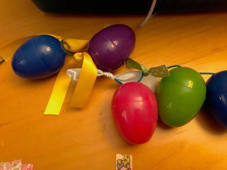 Making a Plastic Egg Garland - knot ribbons between the eggs