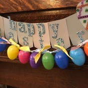 Making a Plastic Egg Garland - garland hung with the banner made earlier