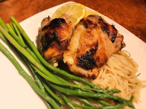 Crispy Lemon Rosemary Chicken on plate with noodles & asparagus