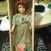 Value of a Paradise Galleries Doll - red haired doll wearing a green dress in the box