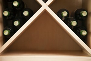 Wine rack with empty space.