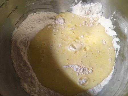 adding egg to flour